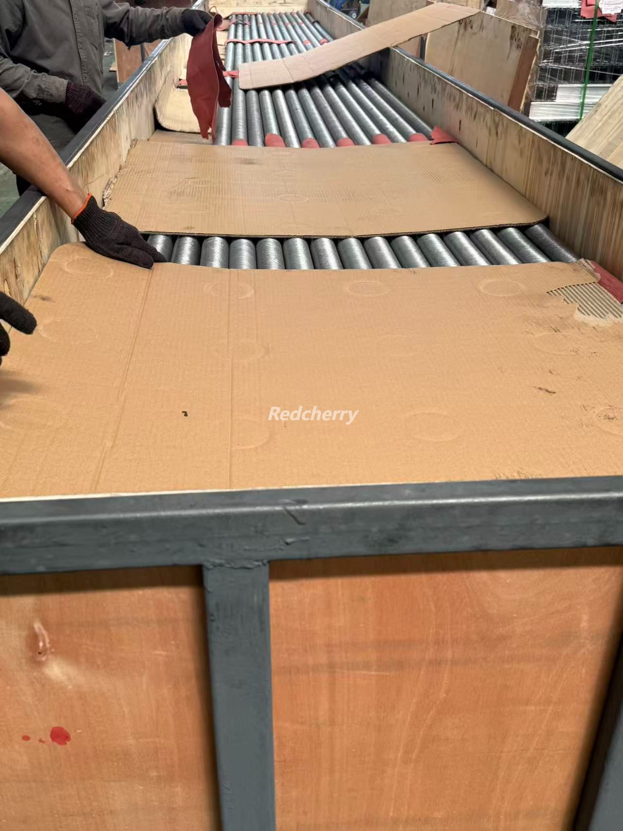 Aluminum finned tubes stacked with cardboard separators to prevent fin damage during shipping.